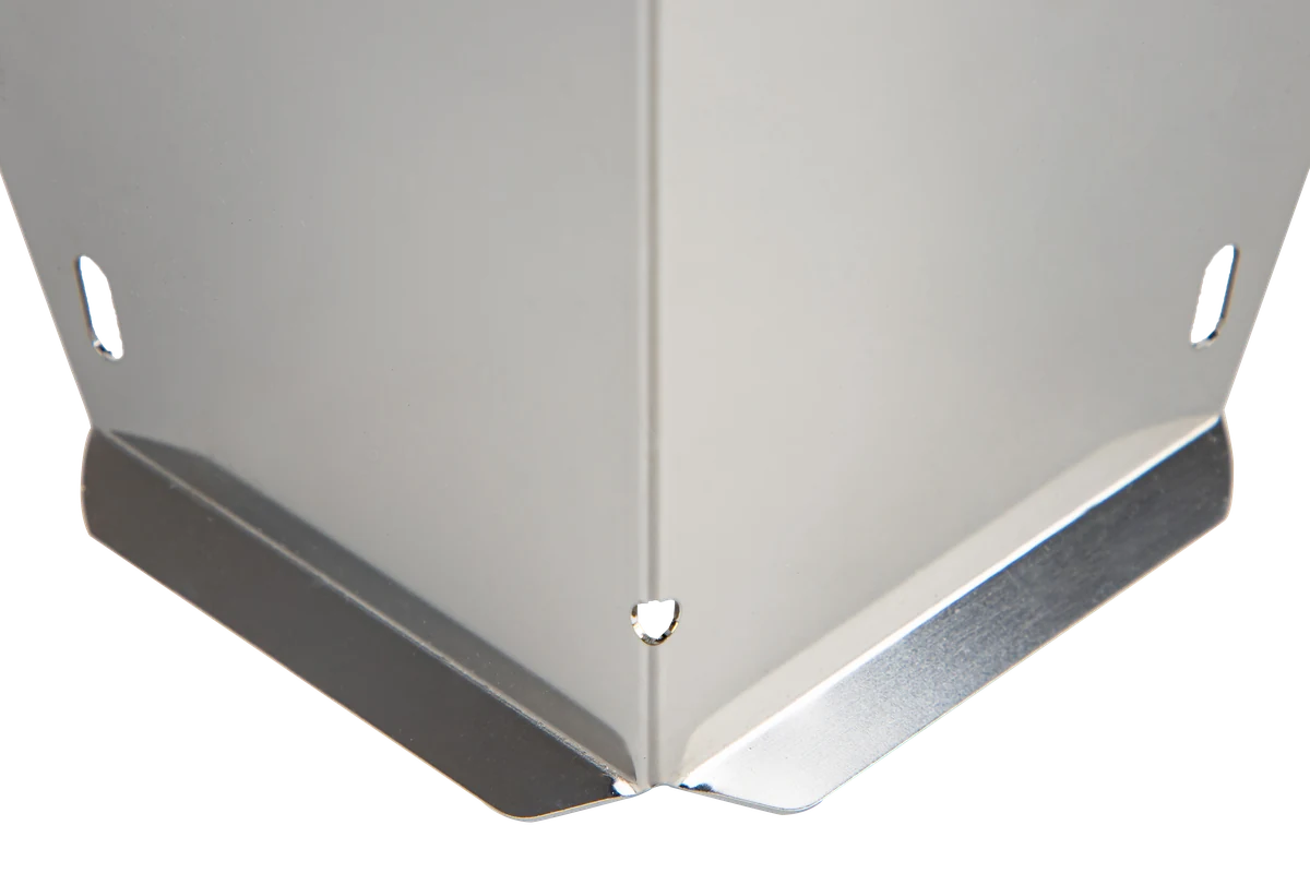 Close-up of a stainless steel bracket's folded corner and slotted mounting holes, showing both a satin and mirror-bright surface