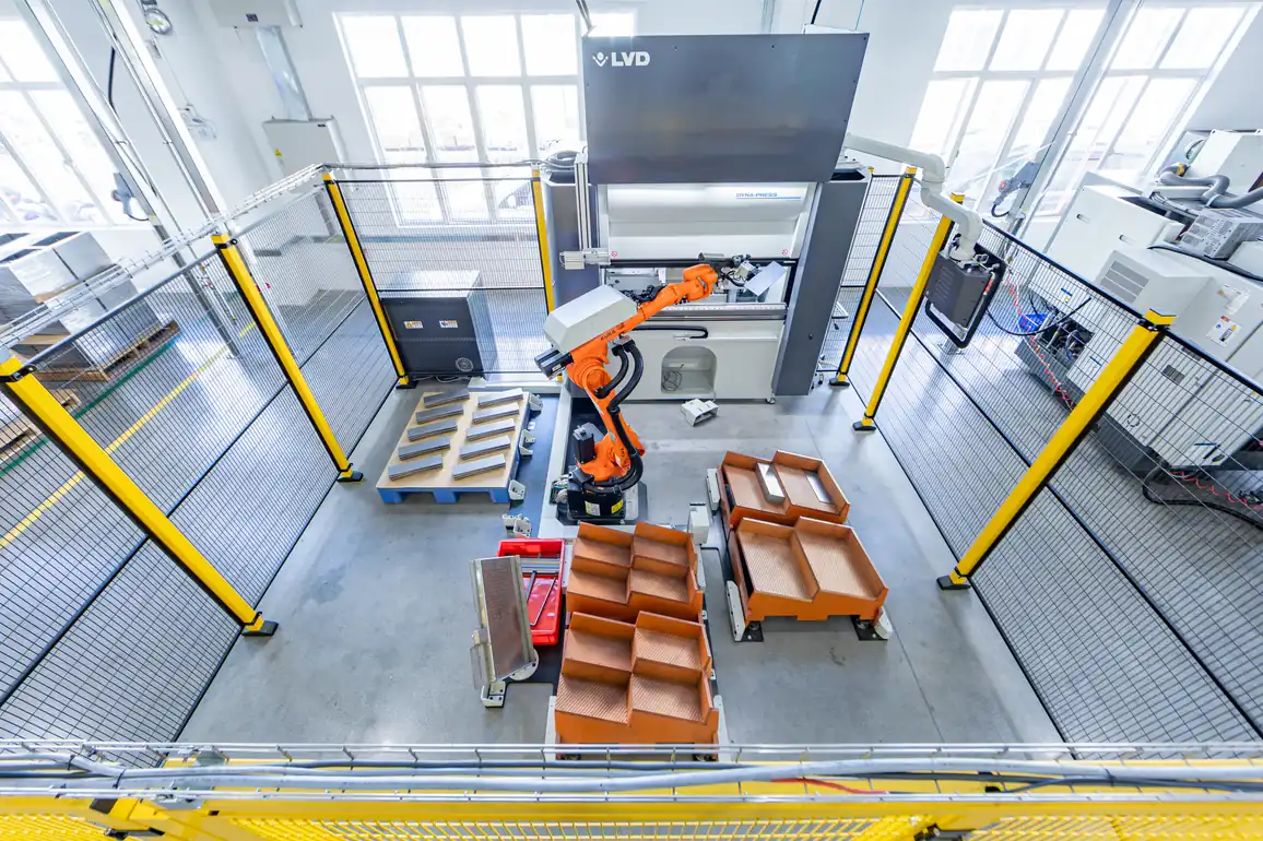 Robotic press brake cell automating sheet metal bending