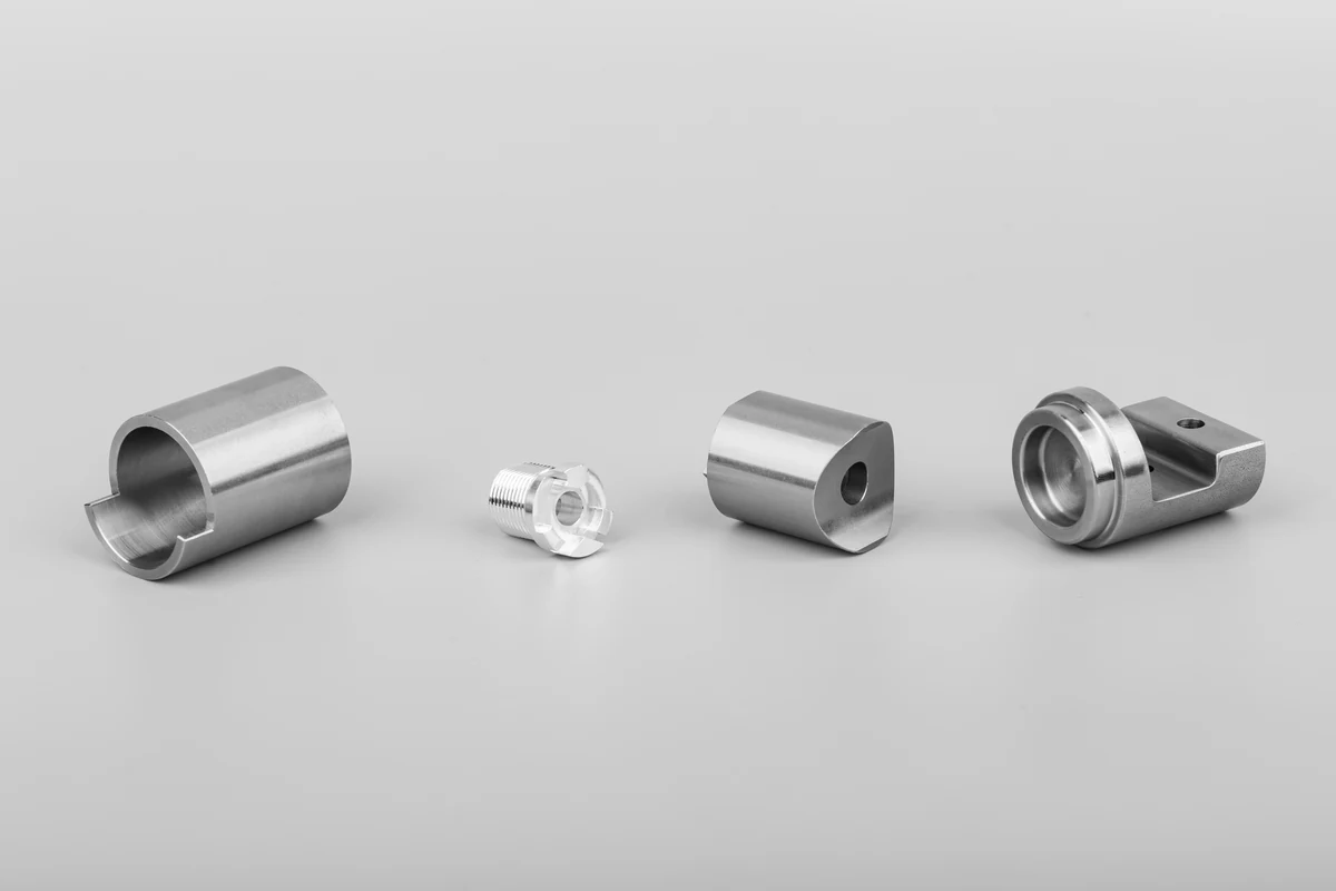 CNC turned sleeve, threaded fitting, spacer and cylindrical housing in steel