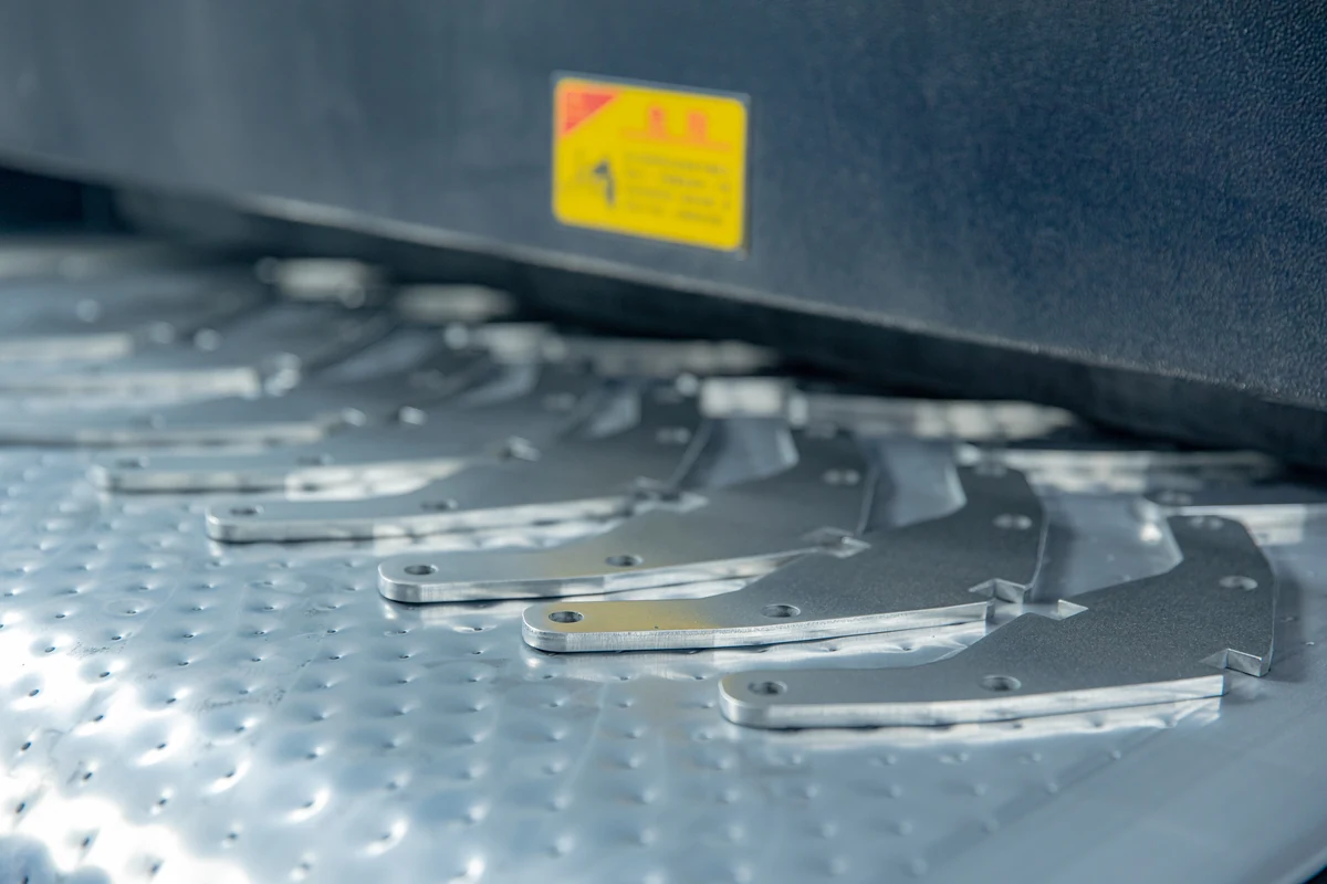 Freshly laser-cut curved sheet metal parts
