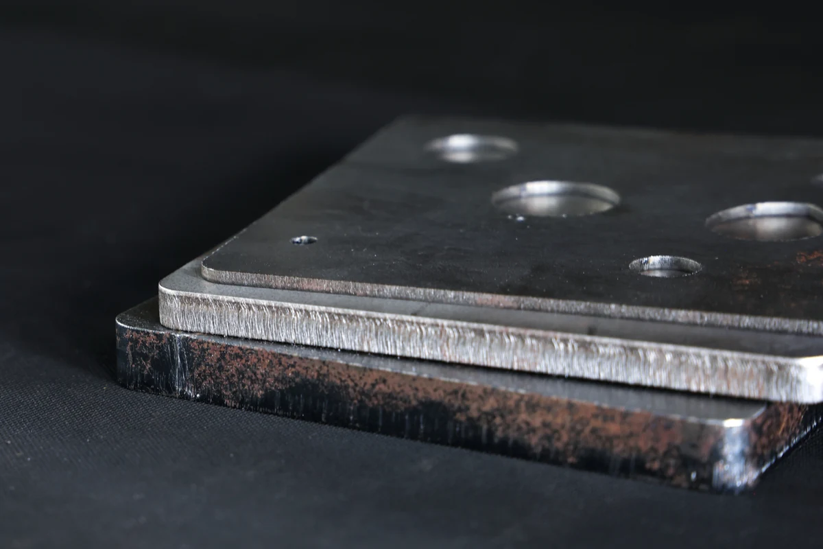 Close-up of laser cut steel edges at 2, 6 and 10 mm showing striation and dross