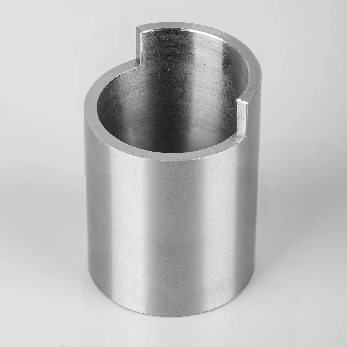CNC turned steel bushing with internal bore and machined keyway slot