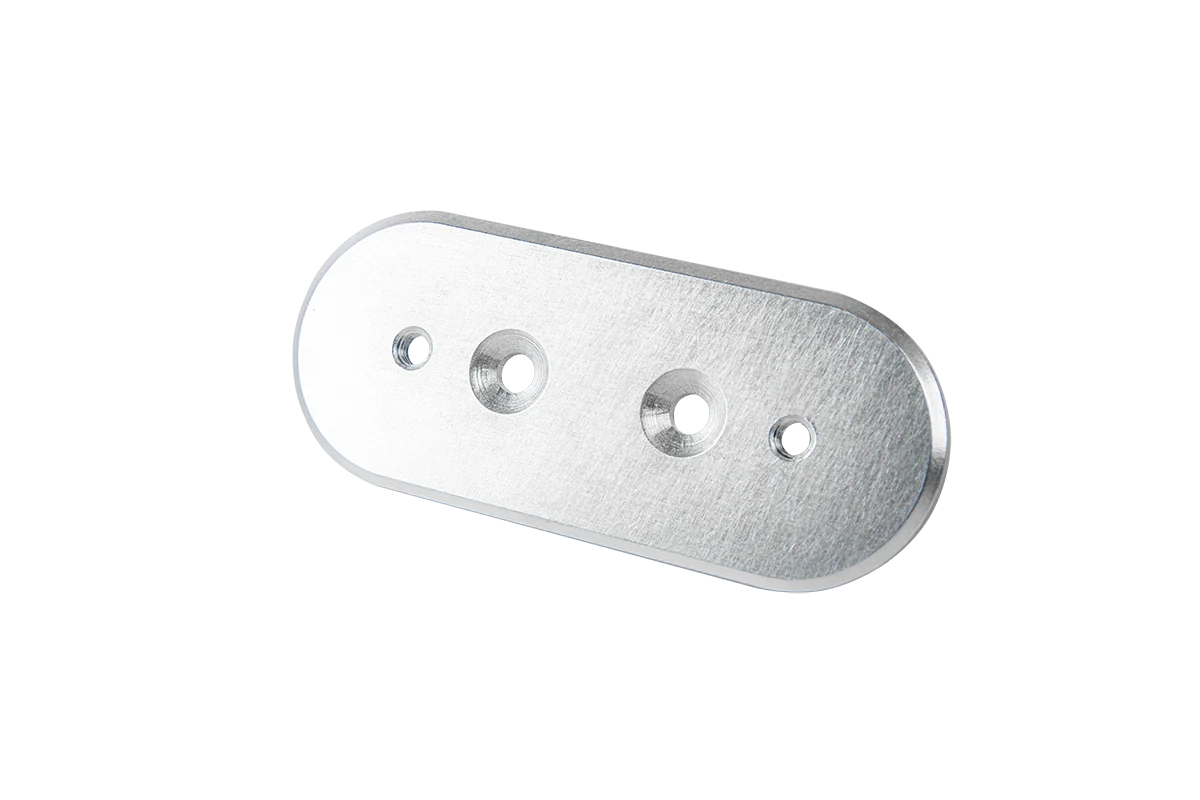Mill-finish aluminum plate with rounded ends, countersunk holes and a faint rolling texture
