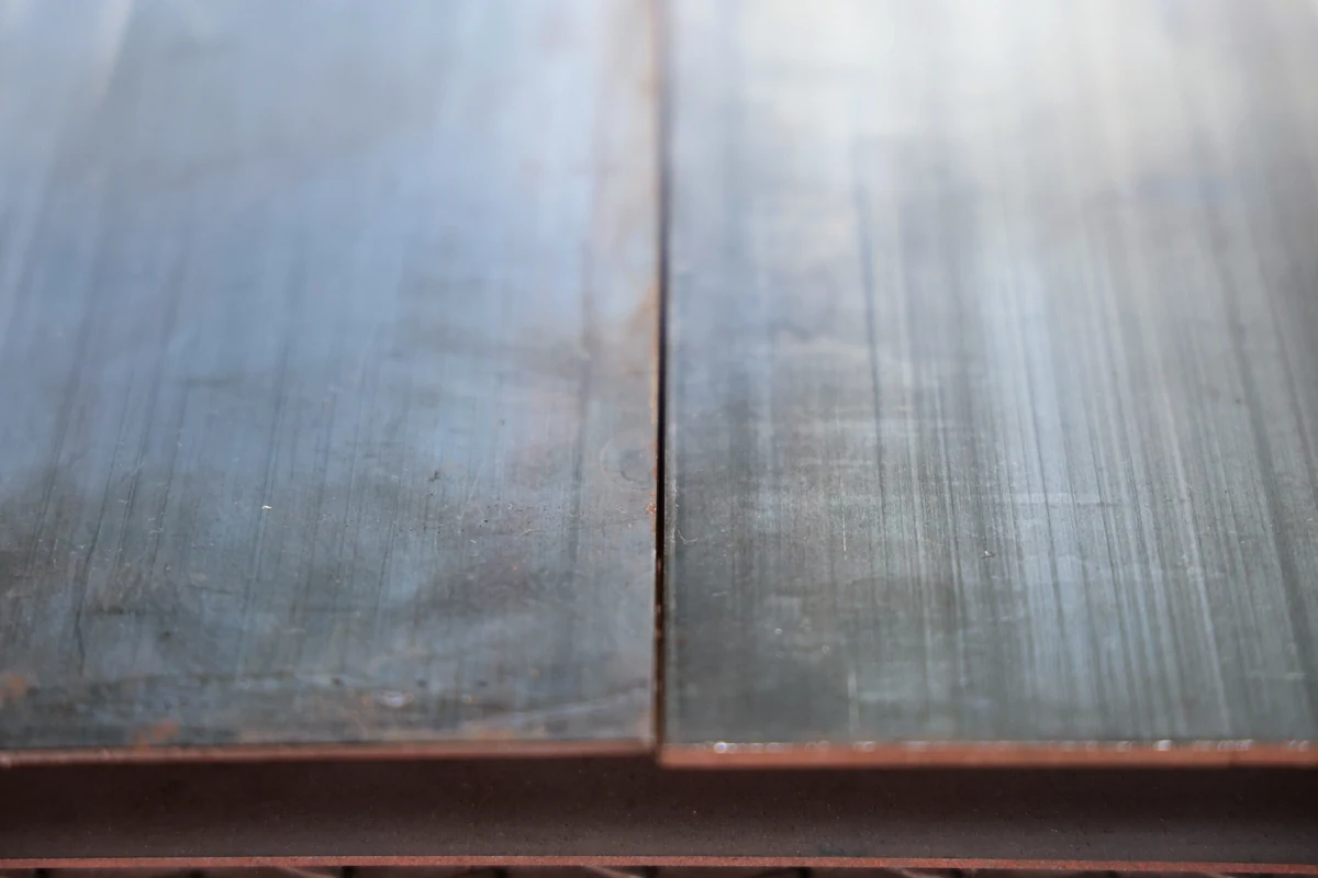65Mn spring steel strip stock at Komacut, showing surface finish and seam detail in close-up